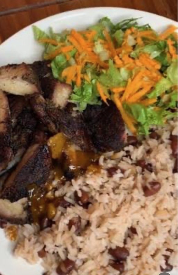Jerk chicken plate with rice and peas and fresh salad